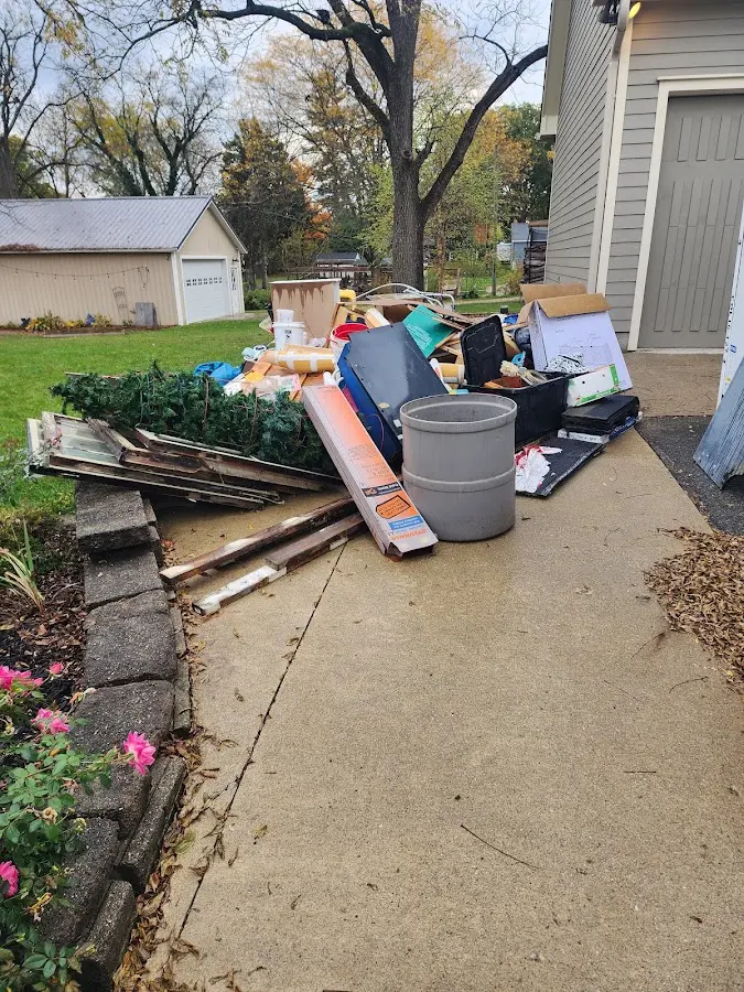 Dumpster being loaded with debris for Residential Dumpster Rental in Charlottesville